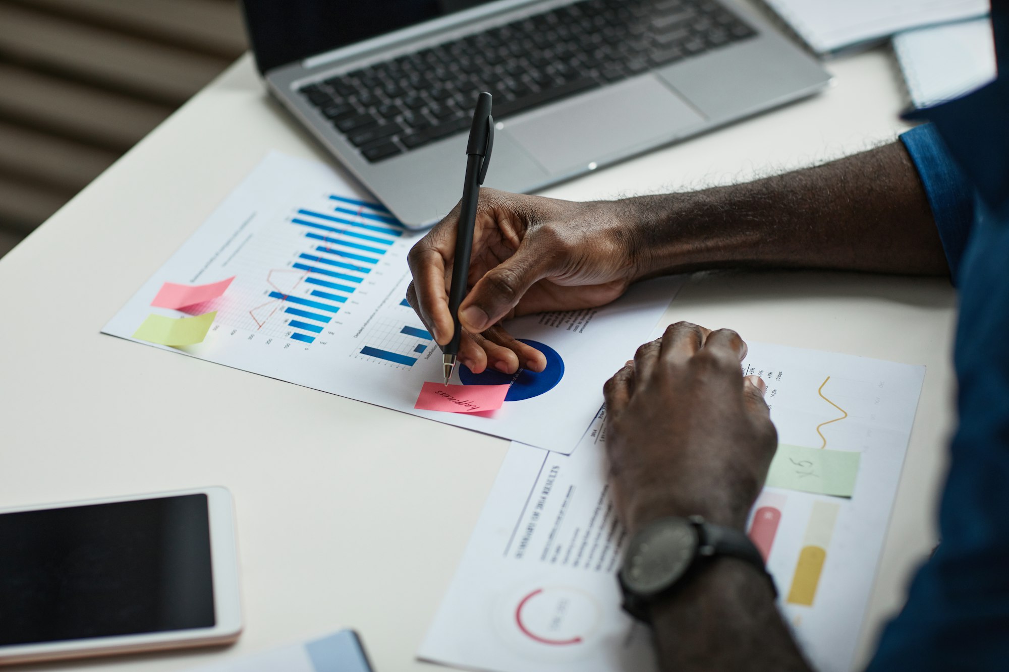 Black Businessman Reviewing Documents Closeup